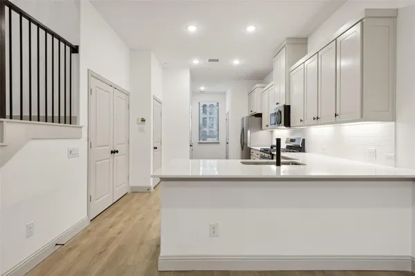 a view of cabinets and window