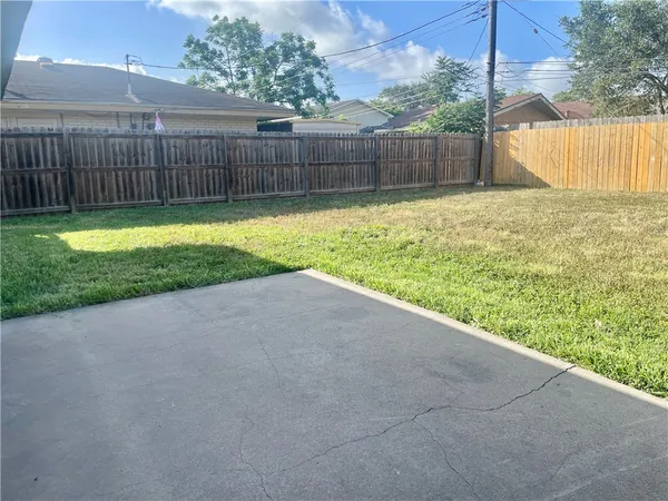 a view of a backyard with a small cabin