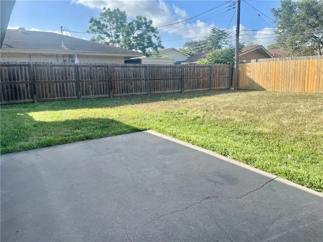 a view of a backyard with a small cabin