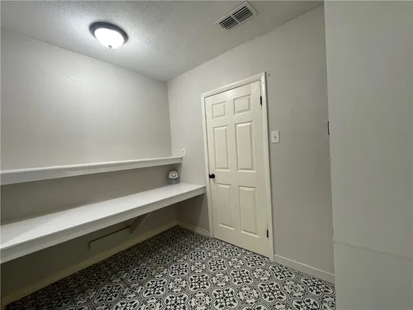 a room with a table and a chair