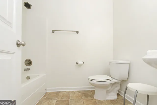 a bathroom with a tub and a shower