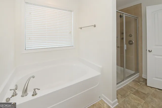 a view of a bathroom from a hallway