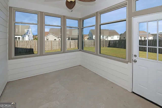 a view of an empty room and window