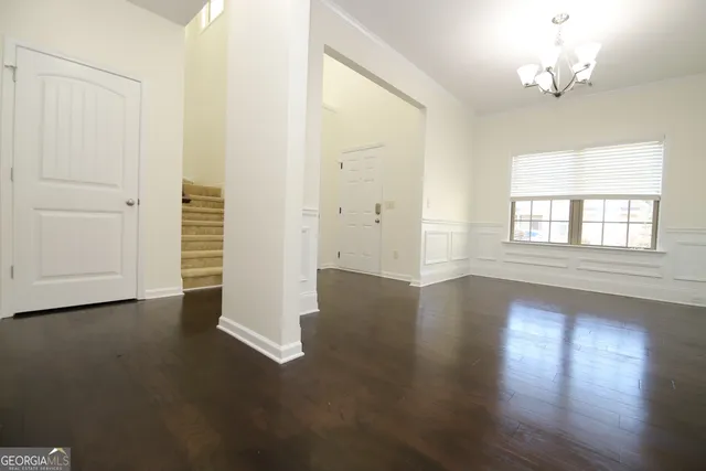 a view of an empty room with a fireplace