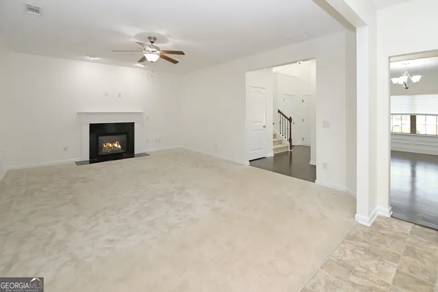 a view of an entryway with wooden floor