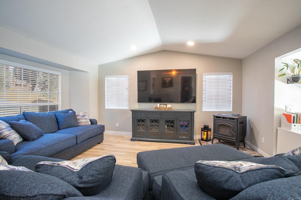 25929 Matlin Road Ramona, CA 92065 - Photo 2 of 19 a living room with furniture and a flat screen tv