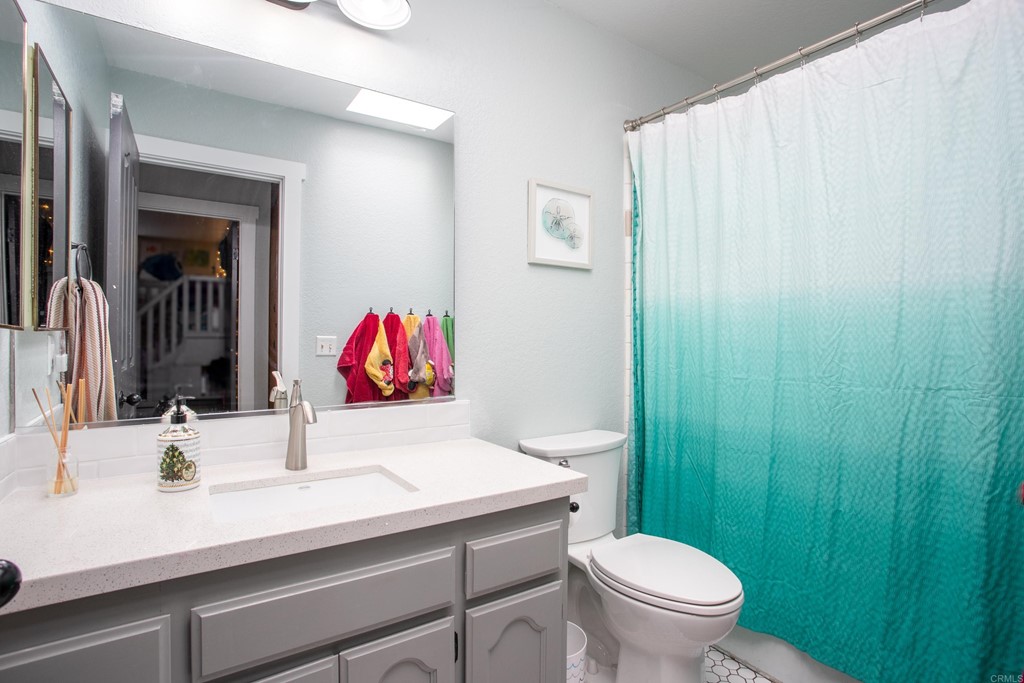 25929 Matlin Road Ramona, CA 92065 - Photo 14 of 19 a bathroom with a sink and a toilet