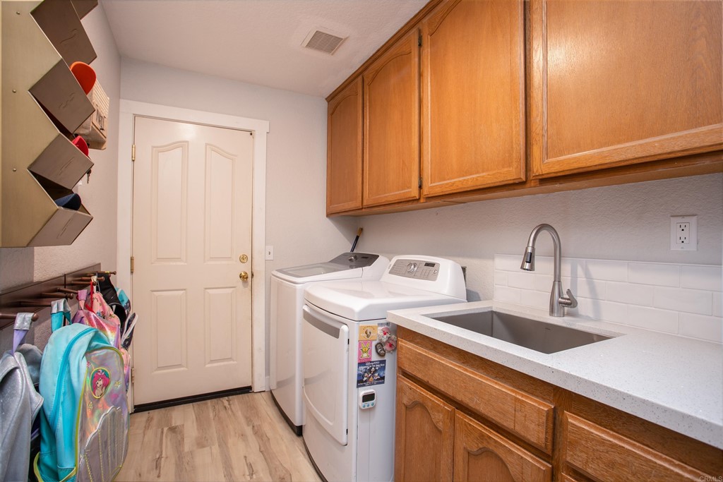 25929 Matlin Road Ramona, CA 92065 - Photo 15 of 19 a utility room with dryer and washer