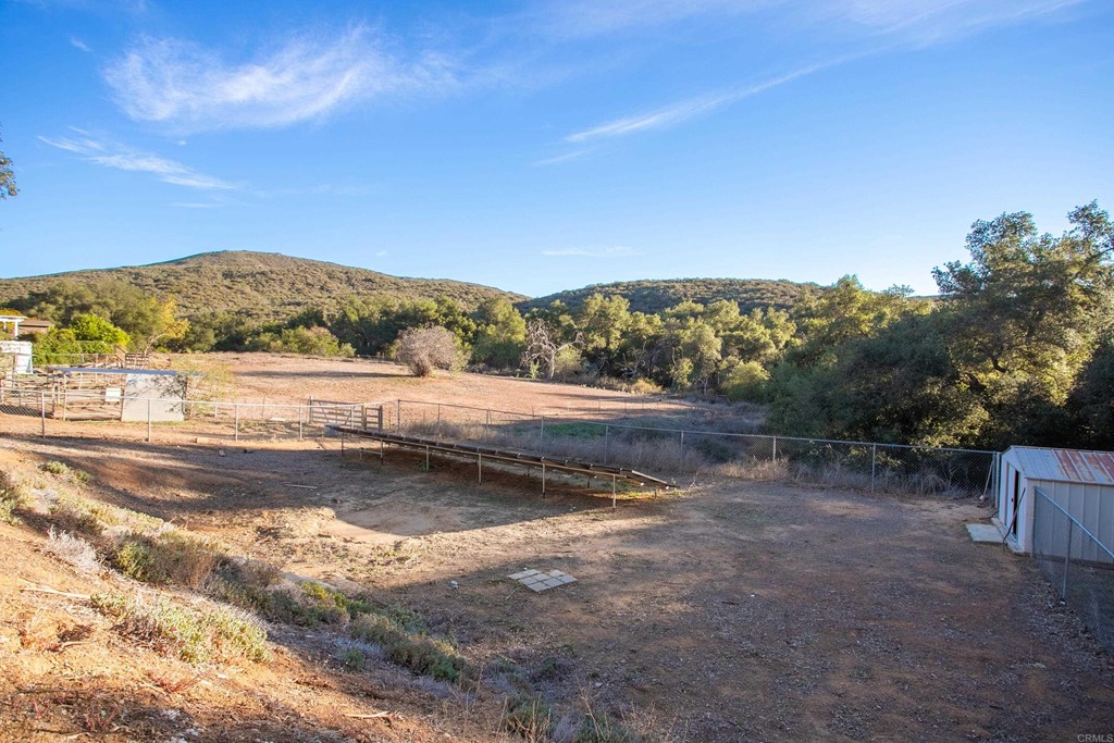 25929 Matlin Road Ramona, CA 92065 - Photo 17 of 19 a view of a lake with mountains in the background