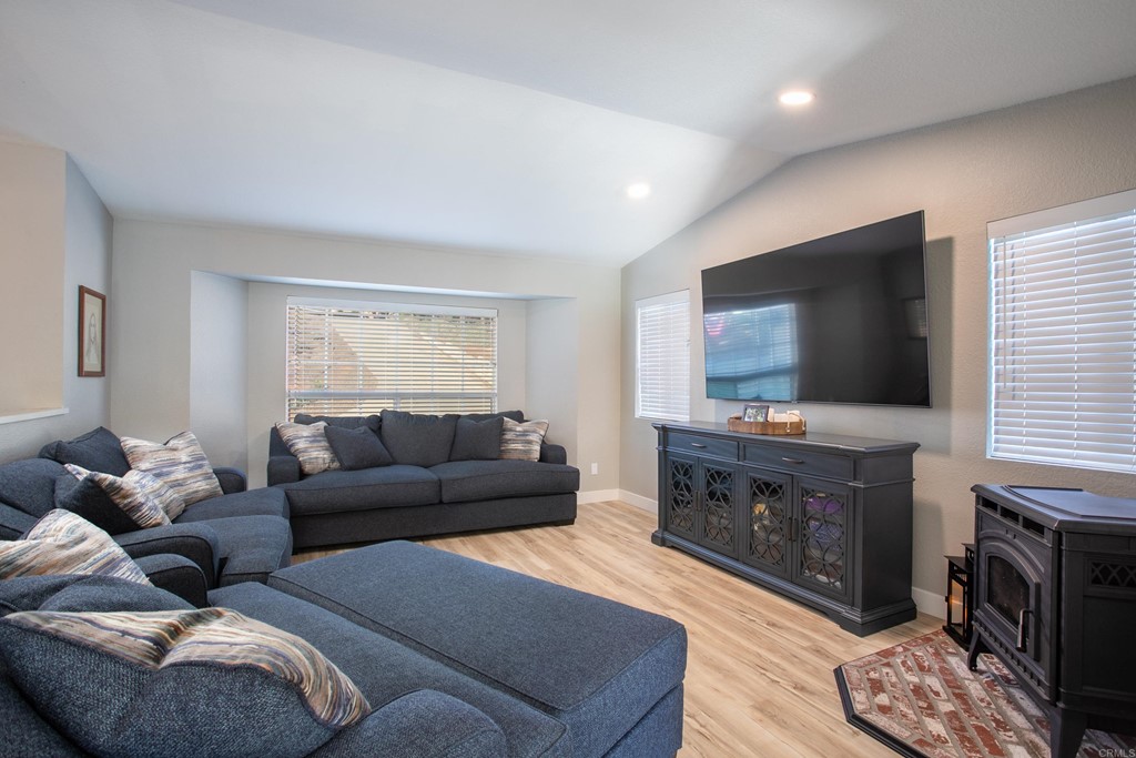 25929 Matlin Road Ramona, CA 92065 - Photo 10 of 19 a living room with furniture and a flat screen tv