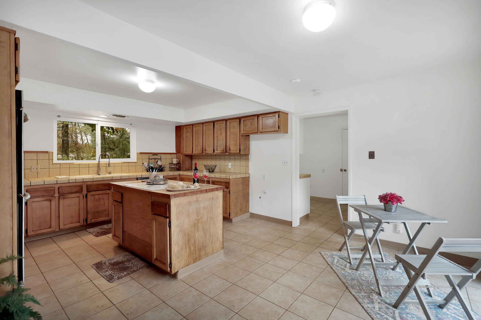 13144 Bear Mountain Road Redding, CA 96003 - Photo 22 of 69 a kitchen with stainless steel appliances granite countertop a stove a sink and a refrigerator