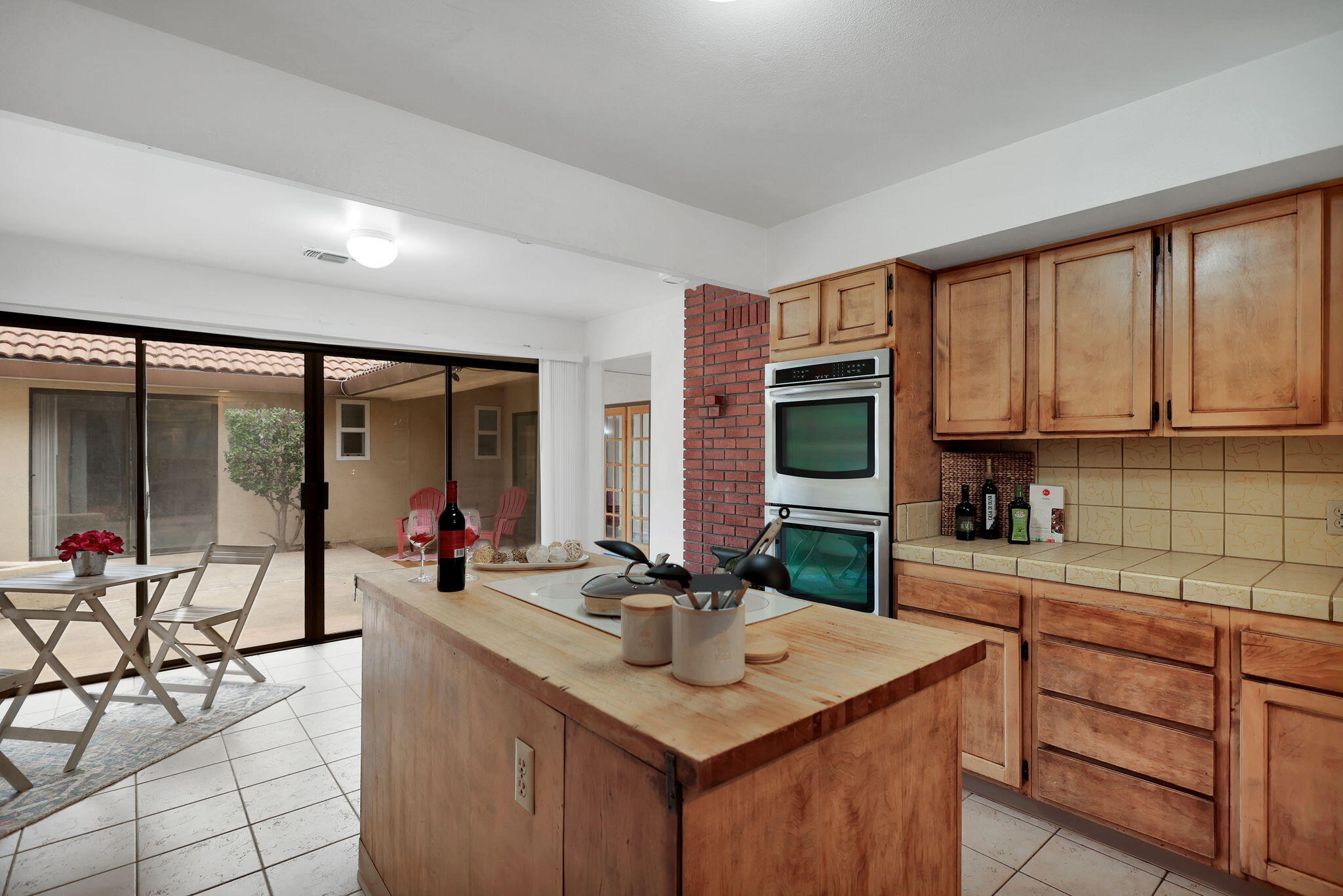 13144 Bear Mountain Road Redding, CA 96003 - Photo 24 of 69 a kitchen with stainless steel appliances granite countertop a sink and cabinets
