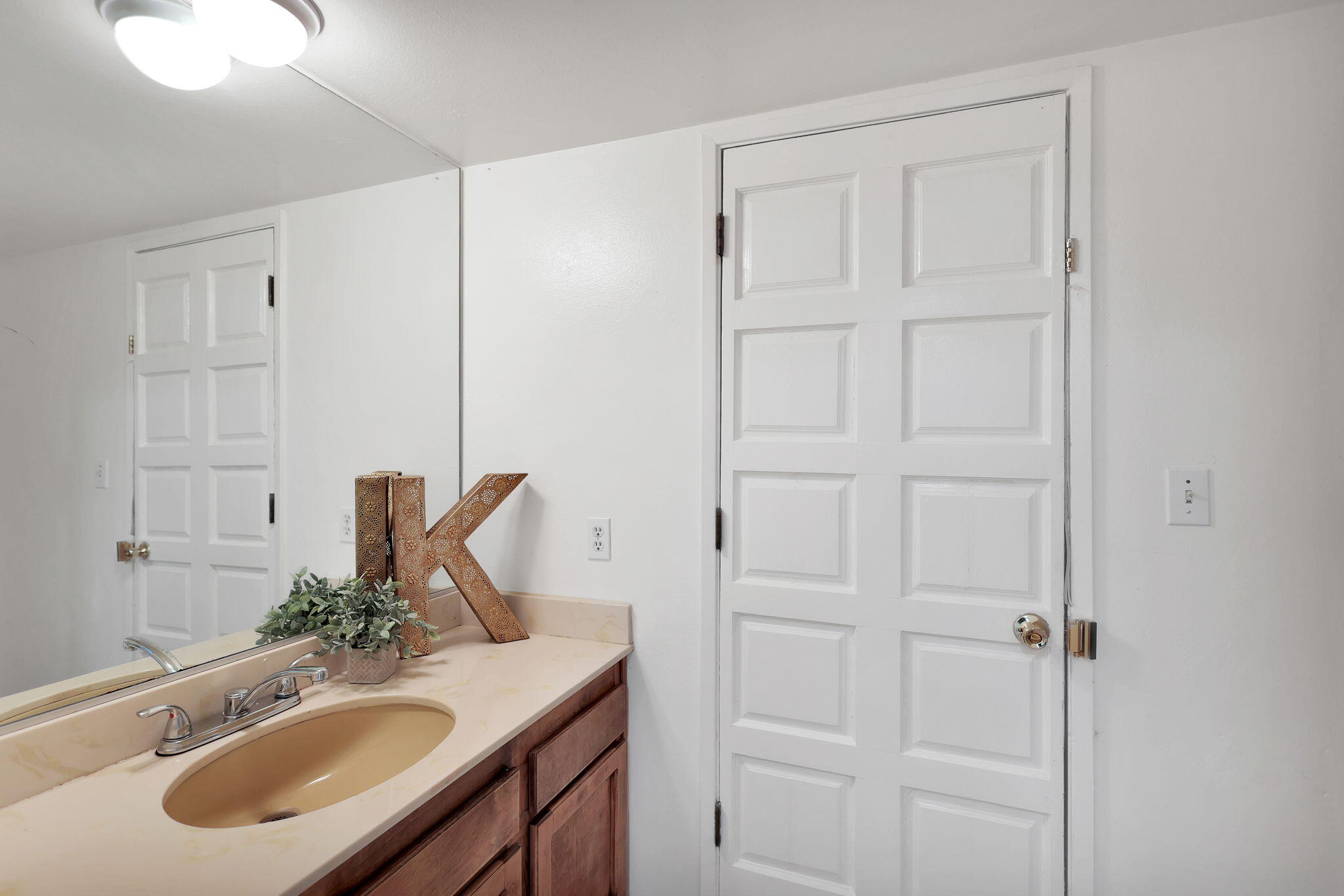 13144 Bear Mountain Road Redding, CA 96003 - Photo 30 of 69 a bathroom with a sink vanity and a mirror