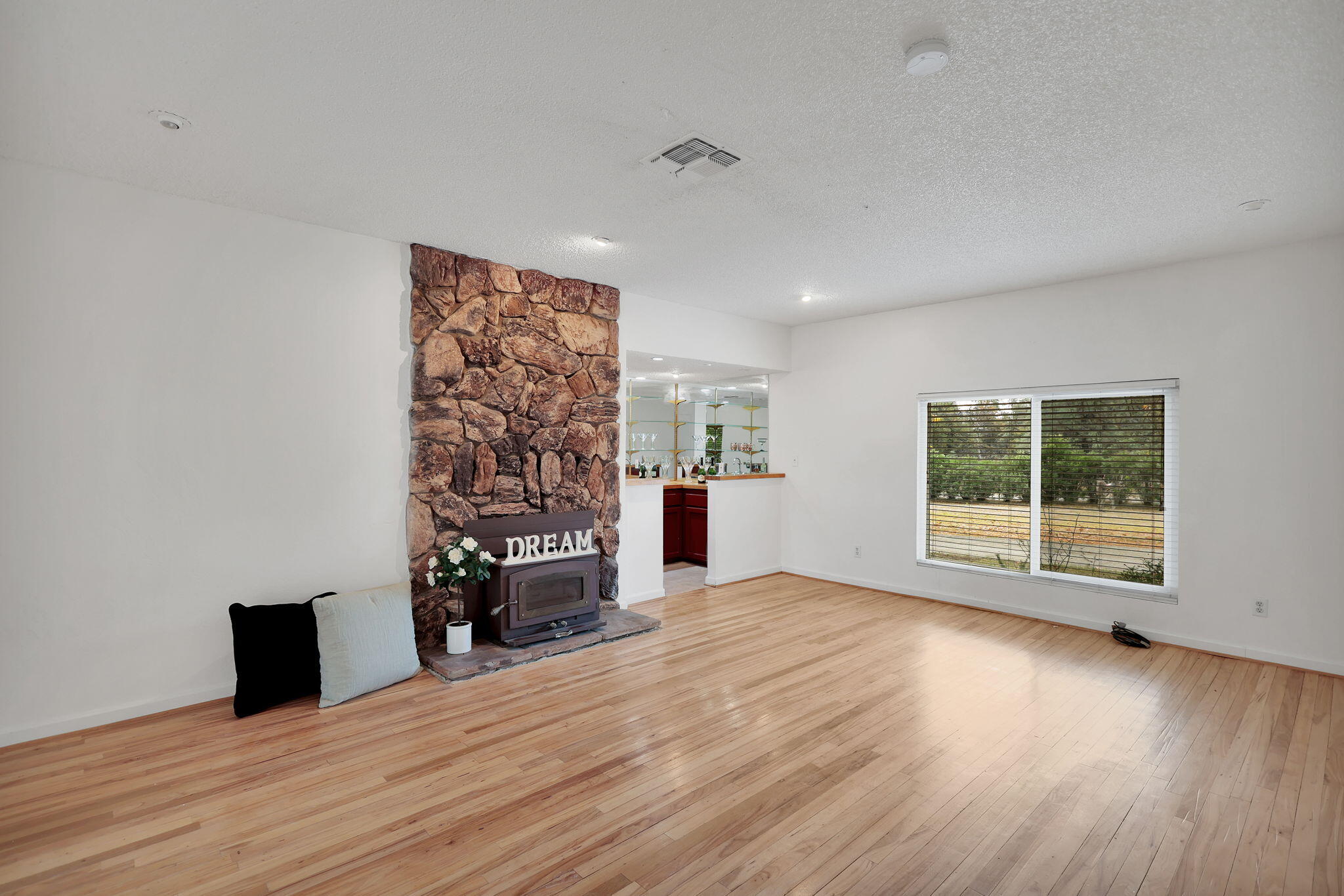 13144 Bear Mountain Road Redding, CA 96003 - Photo 31 of 69 a view of empty room with wooden floor and fan