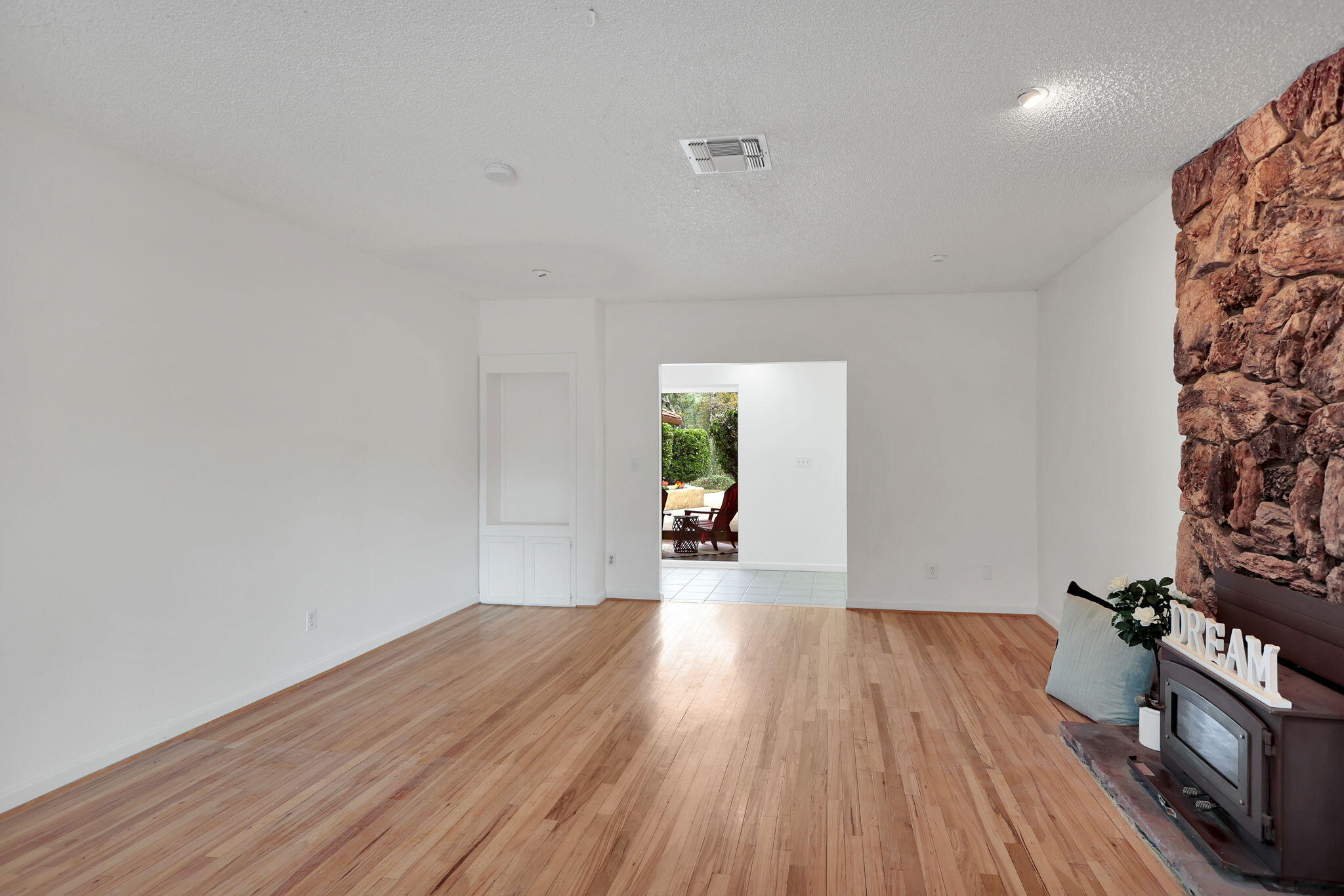 13144 Bear Mountain Road Redding, CA 96003 - Photo 33 of 69 a view of a room with wooden floor and a window