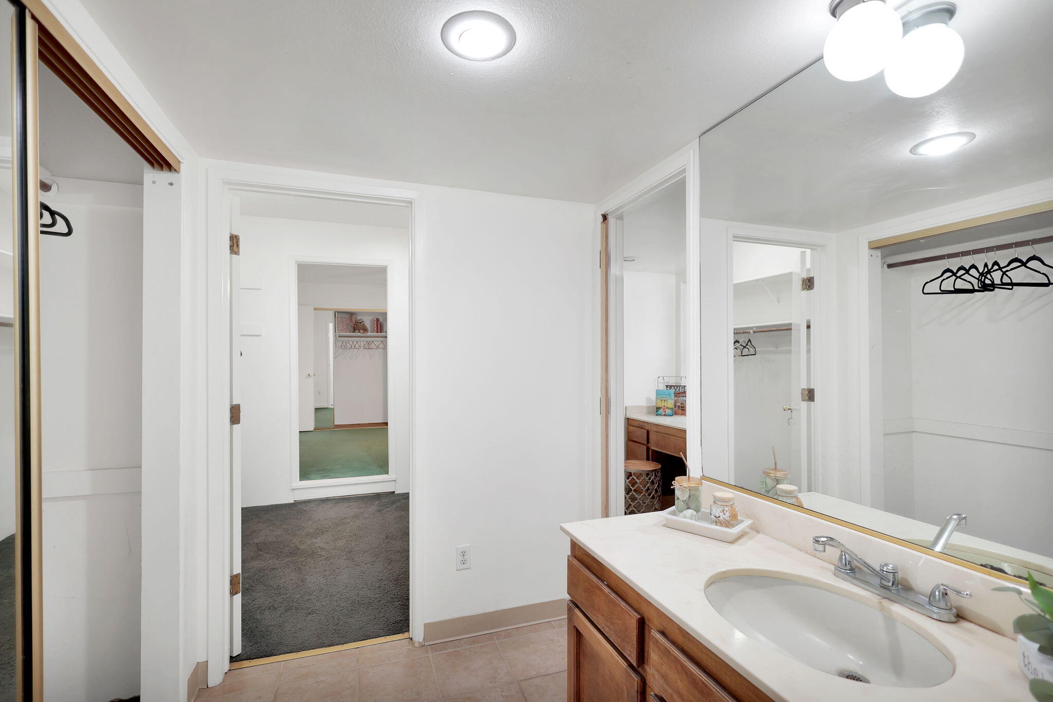13144 Bear Mountain Road Redding, CA 96003 - Photo 37 of 69 a bathroom with a sink and a mirror