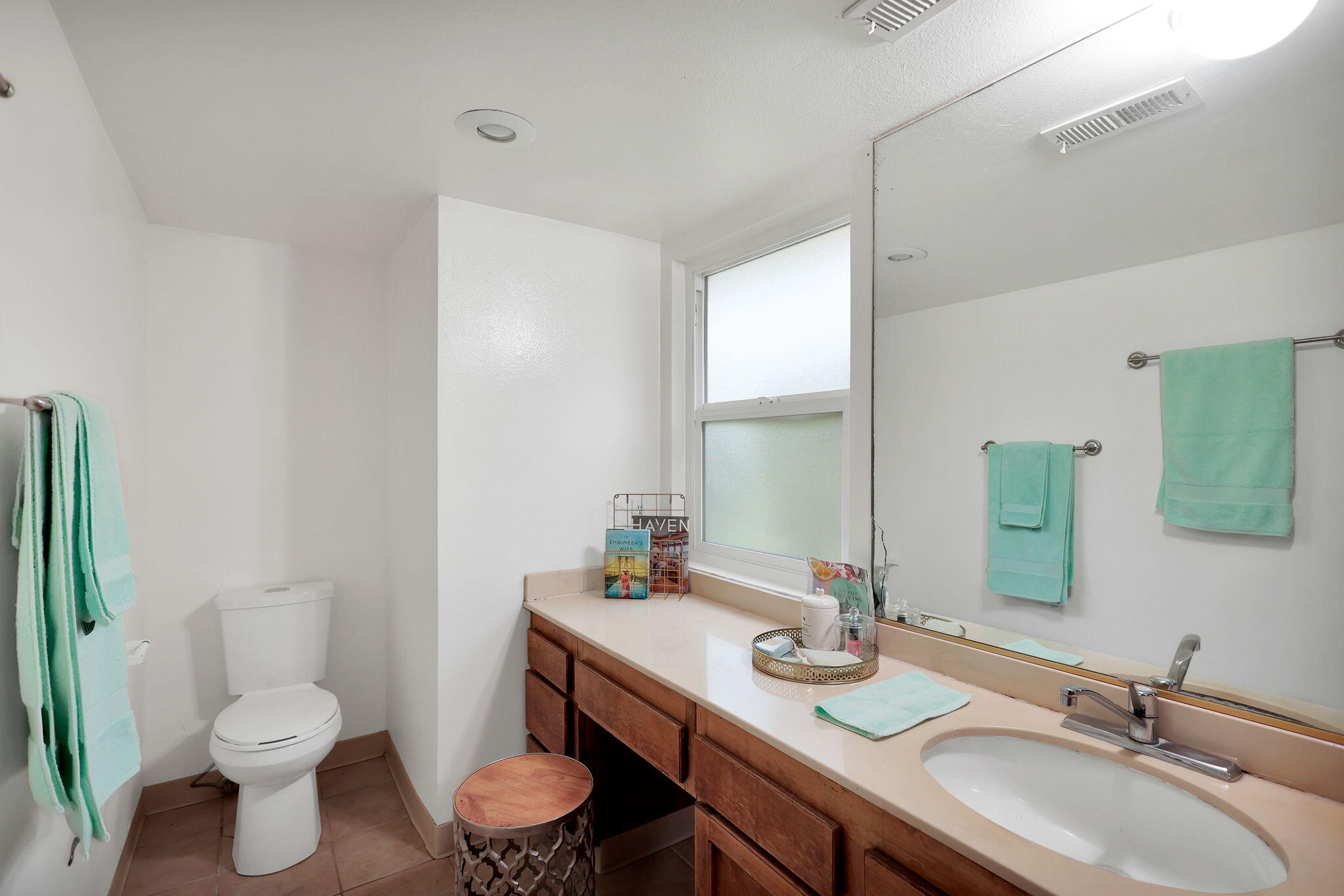 13144 Bear Mountain Road Redding, CA 96003 - Photo 38 of 69 a bathroom with a granite countertop toilet a sink and a mirror