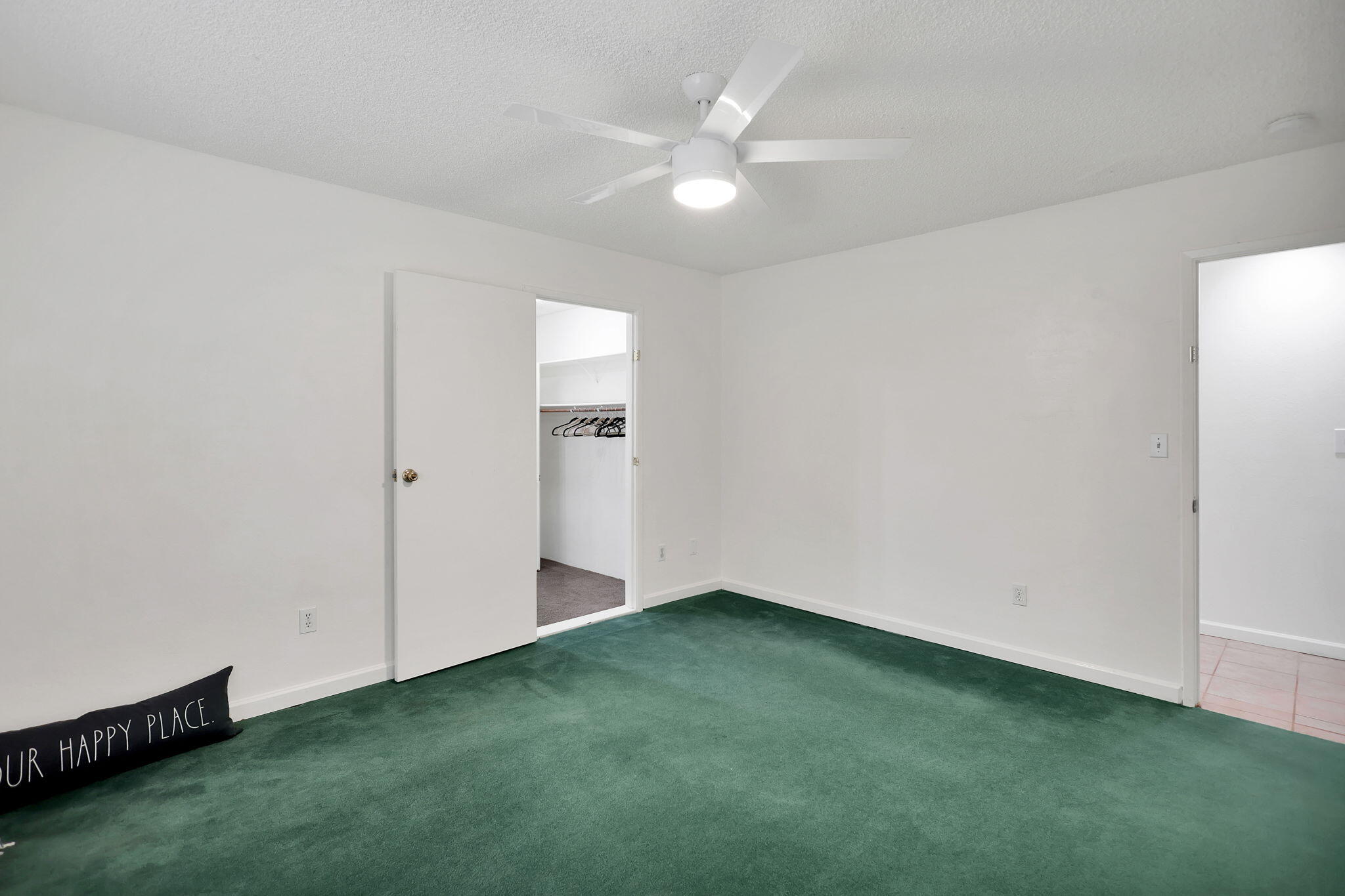 13144 Bear Mountain Road Redding, CA 96003 - Photo 42 of 69 an empty room with a ceiling fan and closet area