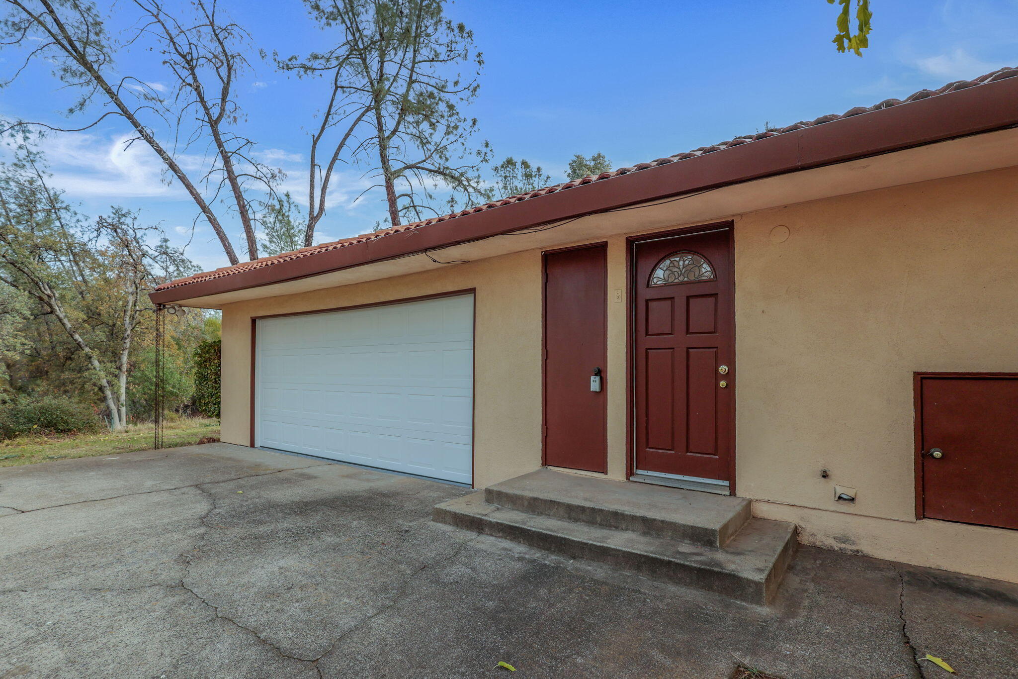 13144 Bear Mountain Road Redding, CA 96003 - Photo 54 of 69 a view of a house with a garage