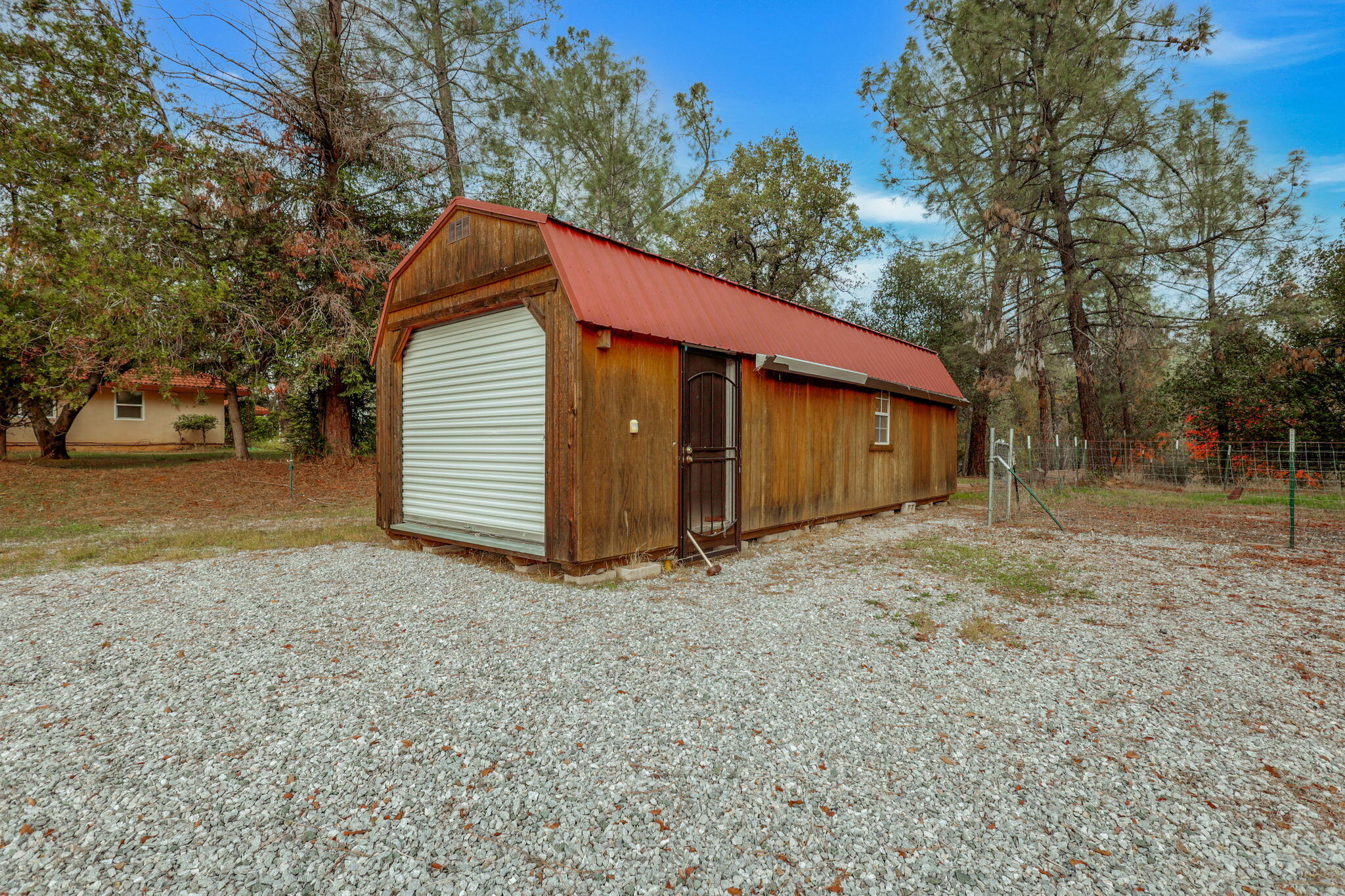 13144 Bear Mountain Road Redding, CA 96003 - Photo 59 of 69 a view of a house with a yard and garage