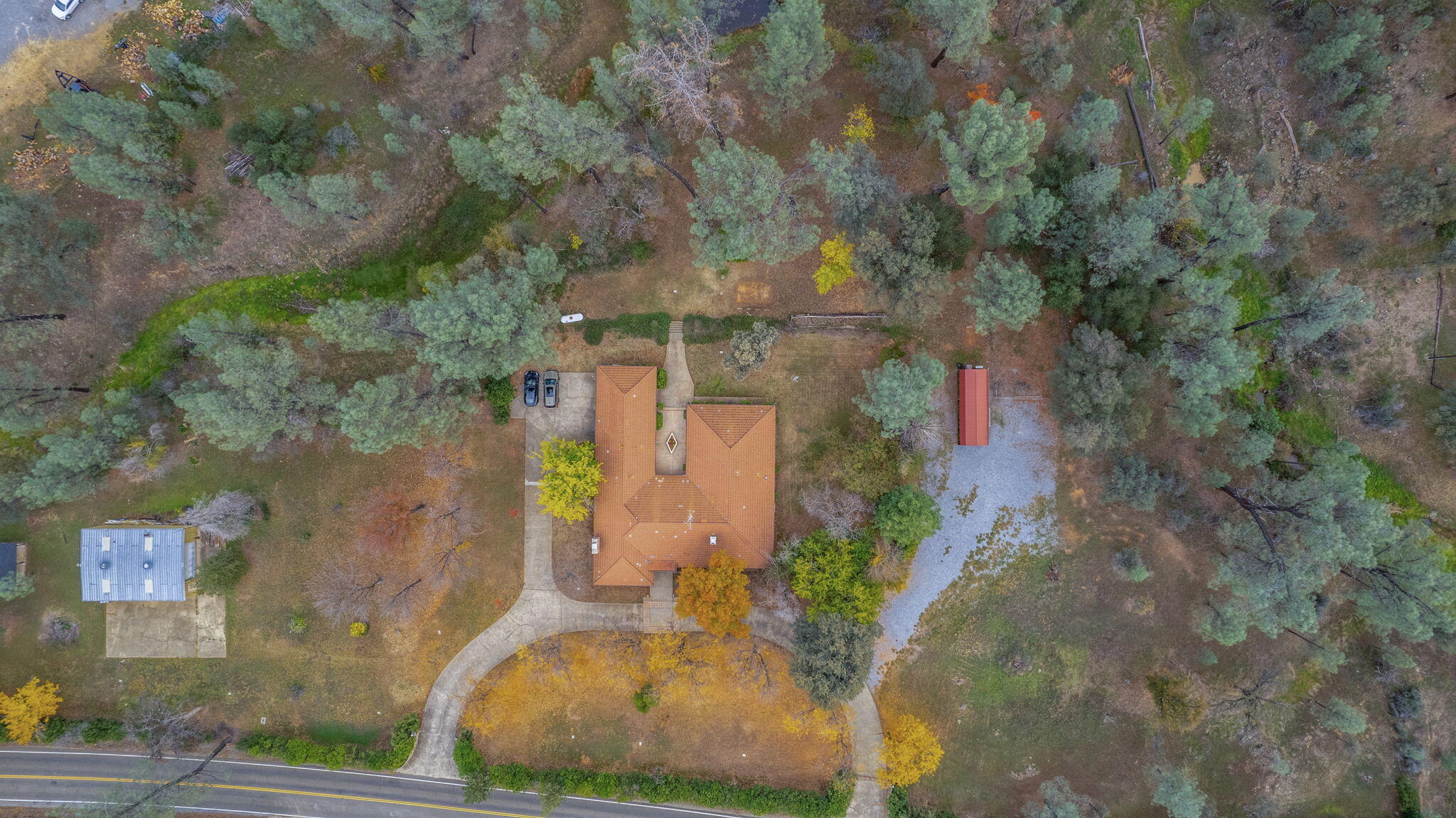 13144 Bear Mountain Road Redding, CA 96003 - Photo 66 of 69 an aerial view of a house with a yard