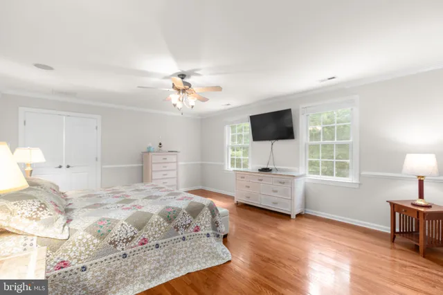 an aerial view of a house with a yard and fountain