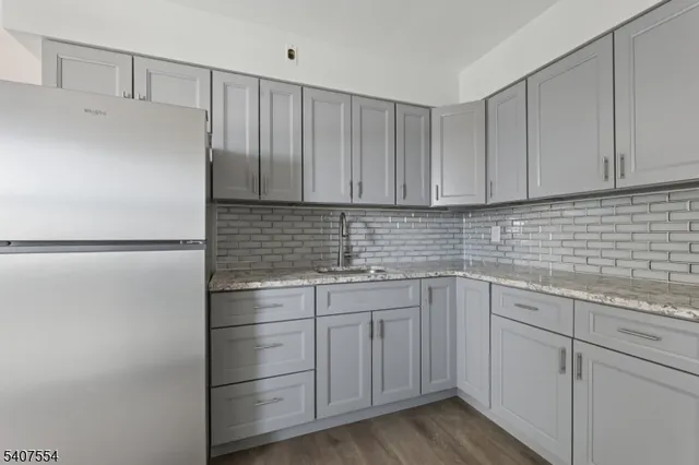 a kitchen with a sink and cabinets