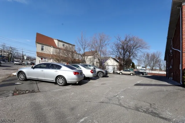 a view of street with parked cars