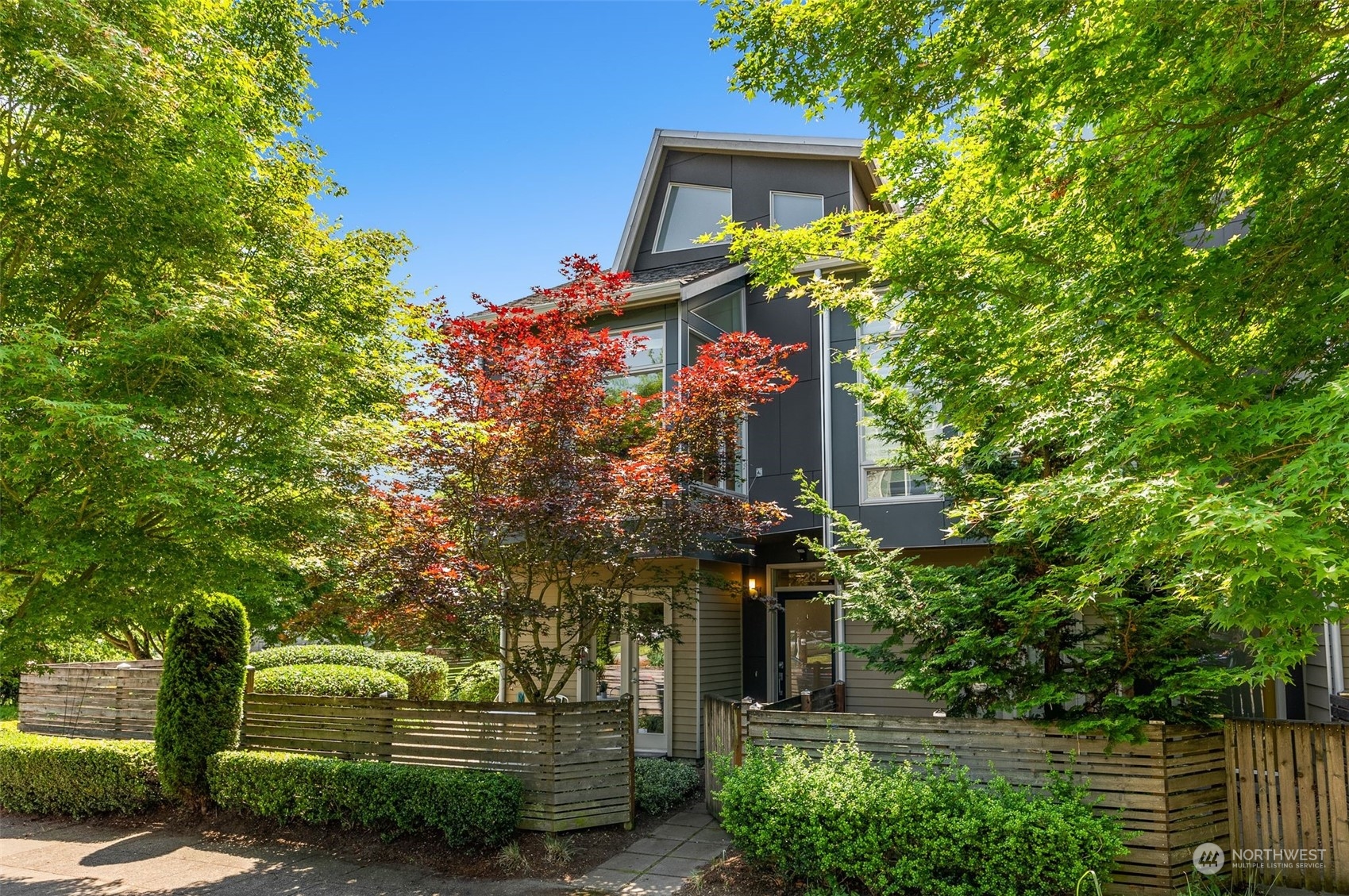 723 North 42nd Street Seattle, WA 98103 - Photo 1 of 27 a front view of a house with a yard and tree s