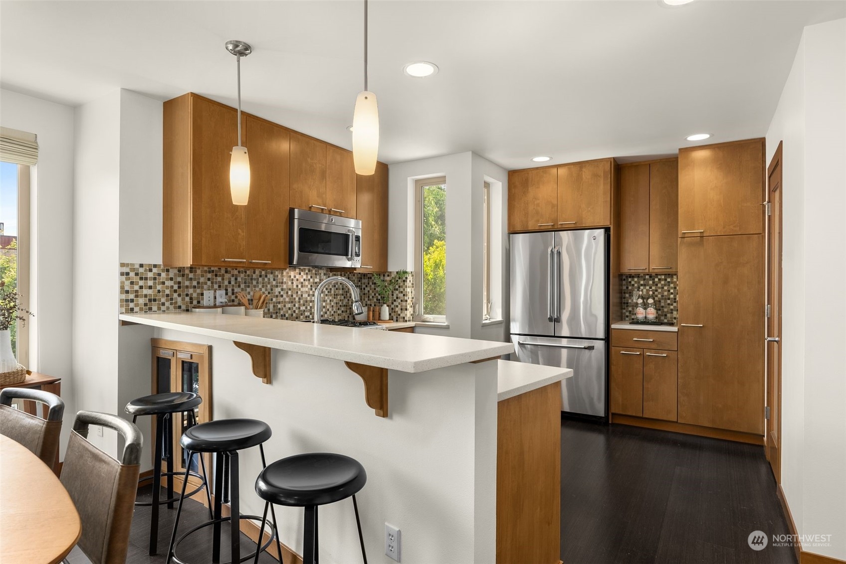 723 North 42nd Street Seattle, WA 98103 - Photo 15 of 27 a kitchen with refrigerator and chairs