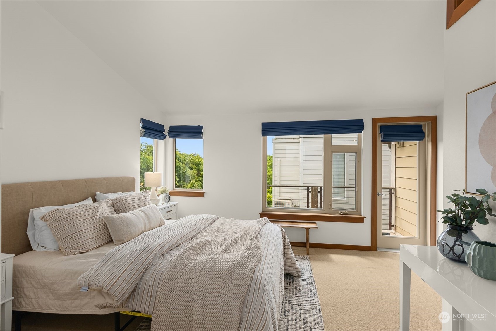 723 North 42nd Street Seattle, WA 98103 - Photo 19 of 27 a bedroom with a bed and a large window