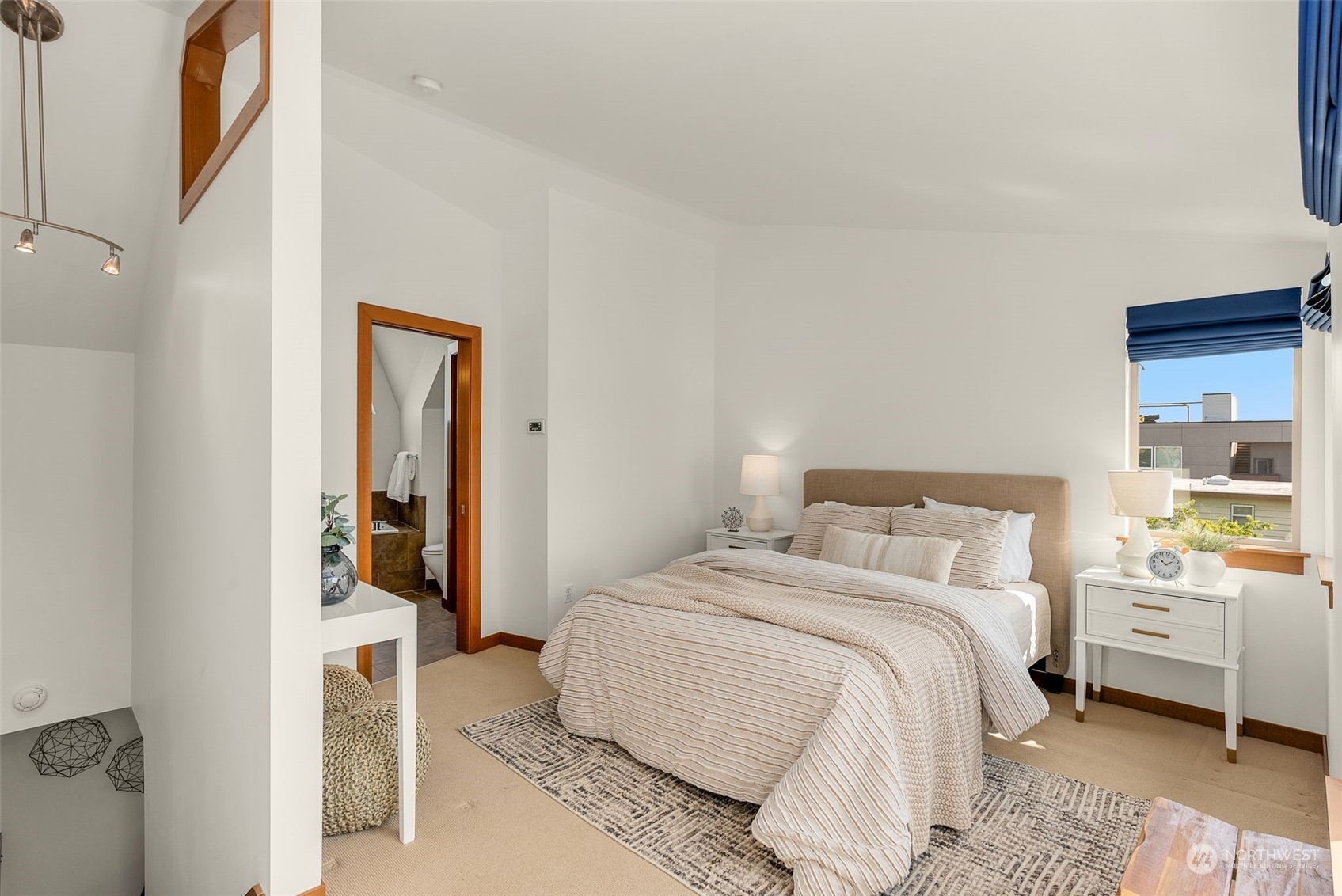 723 North 42nd Street Seattle, WA 98103 - Photo 20 of 27 a bedroom with a bed and a cabinets