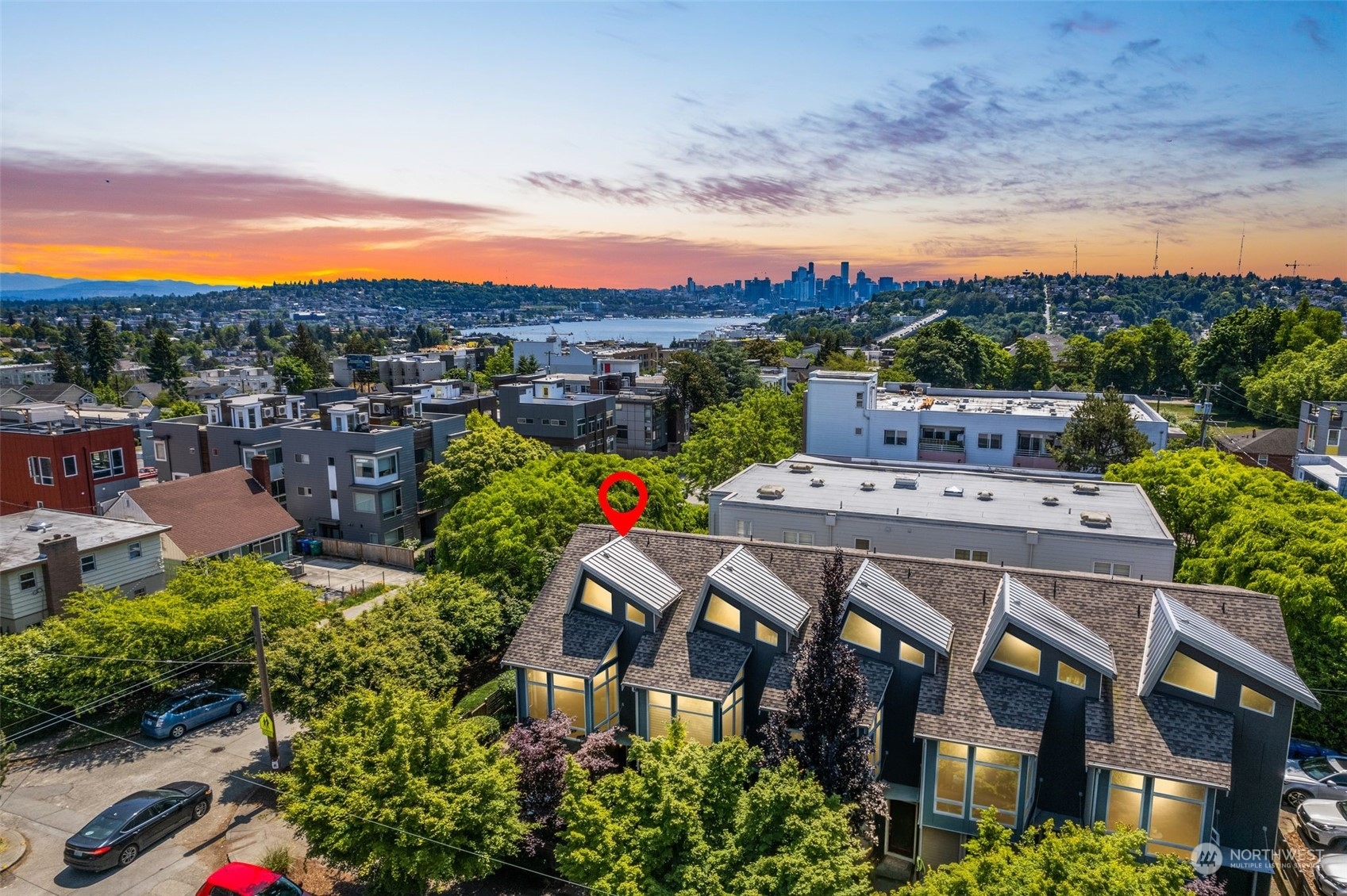 723 North 42nd Street Seattle, WA 98103 - Photo 2 of 27 a view of a patio with table and chairs and potted plants
