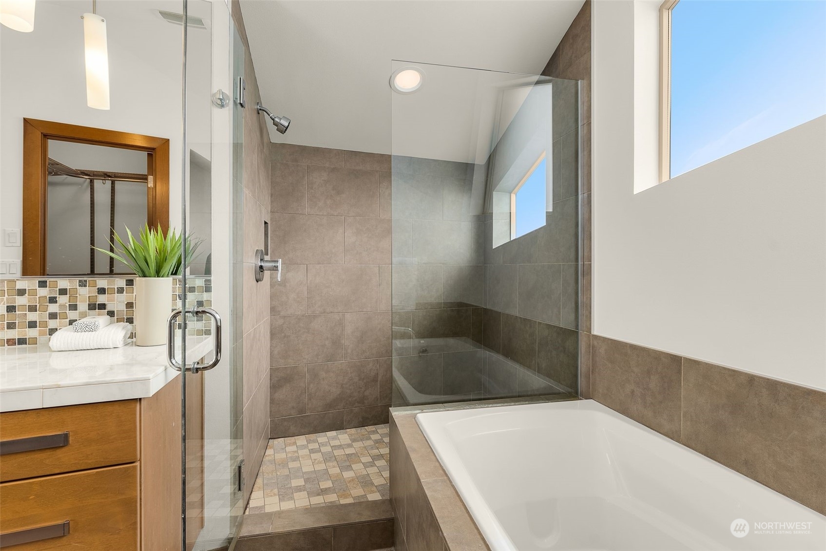 723 North 42nd Street Seattle, WA 98103 - Photo 22 of 27 a bathroom with a tub sink and mirror