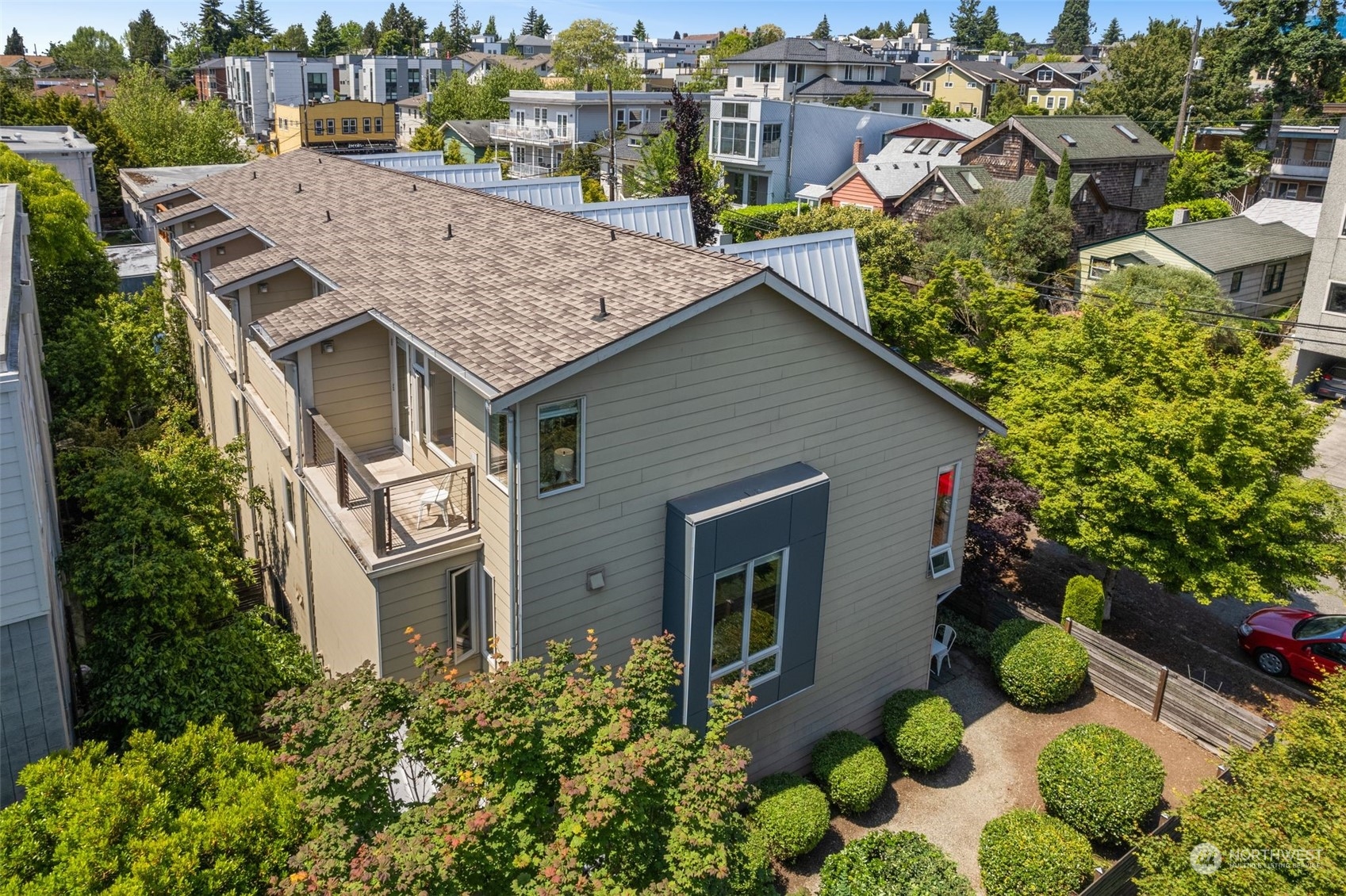 723 North 42nd Street Seattle, WA 98103 - Photo 26 of 27 a aerial view of a house with a yard and potted plants