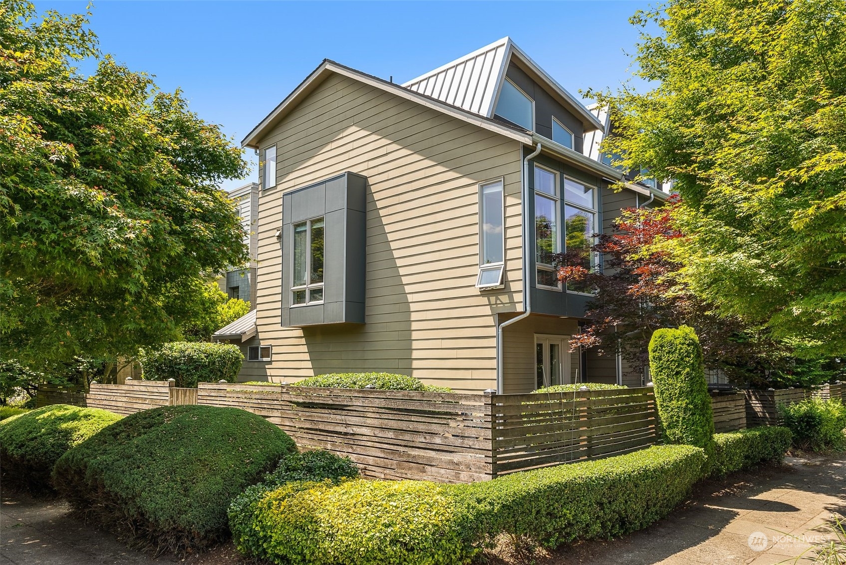 723 North 42nd Street Seattle, WA 98103 - Photo 3 of 27 a front view of a house with a yard