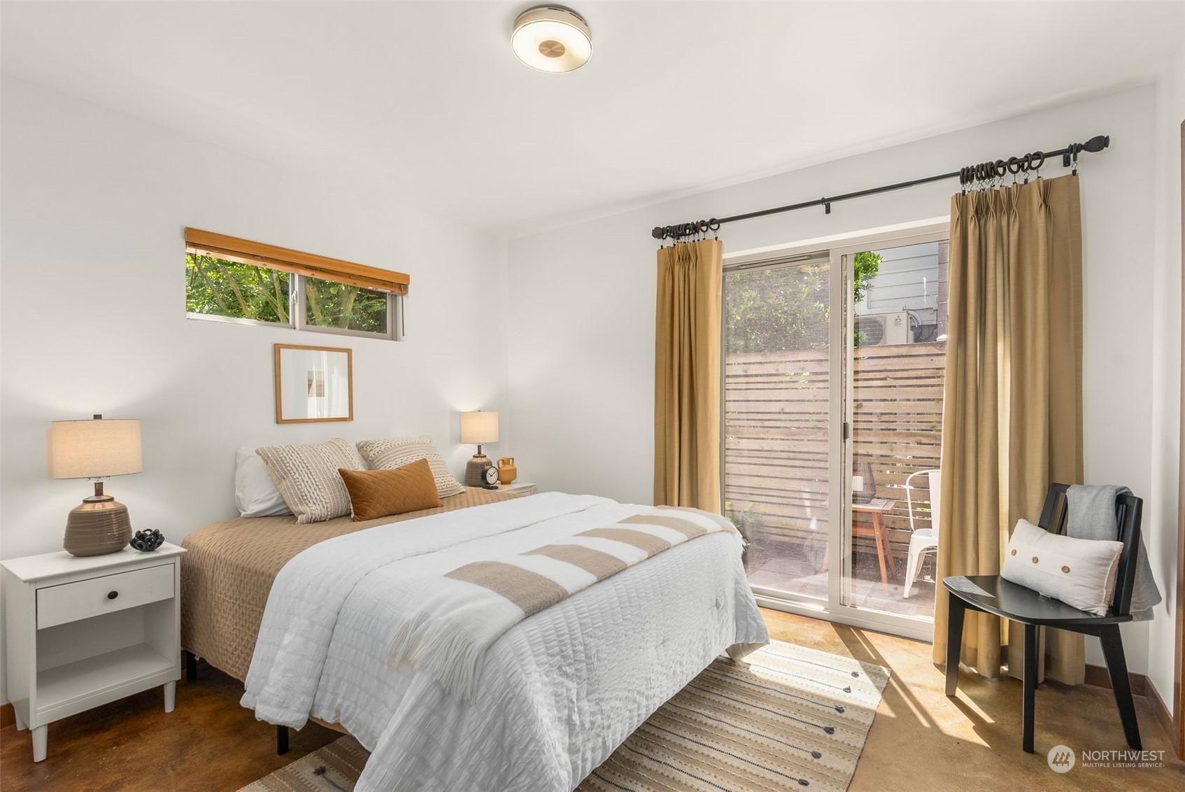 723 North 42nd Street Seattle, WA 98103 - Photo 8 of 27 a bedroom with a bed and a window