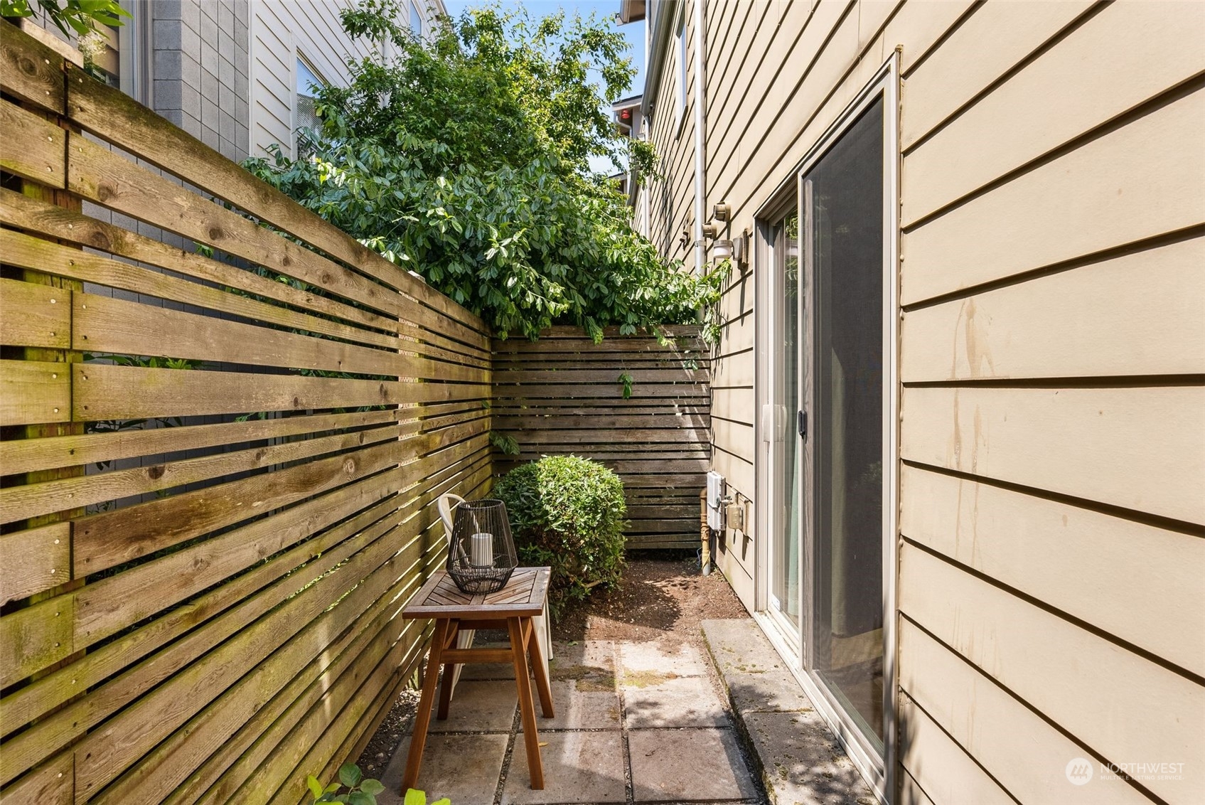 723 North 42nd Street Seattle, WA 98103 - Photo 9 of 27 a view of a chairs with a potted plant on a wall