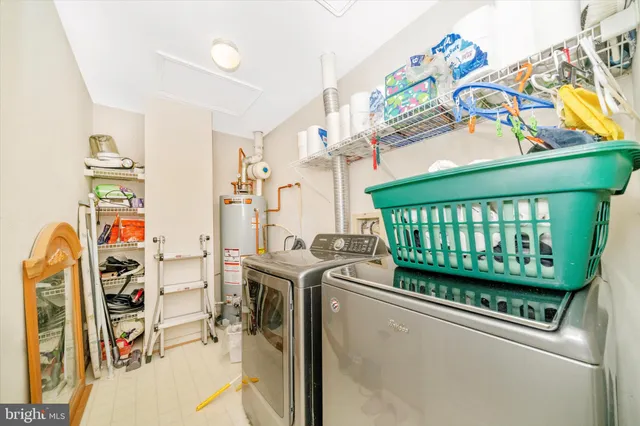 a living room with a baby crib and a couch