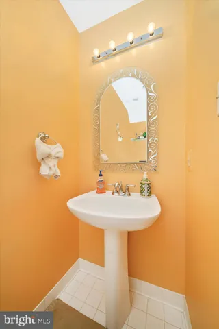 a bathroom with a sink a mirror and vanity