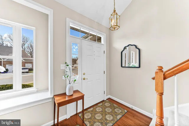 a view of an entryway with wooden floor