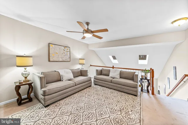 a living room with furniture and a rug