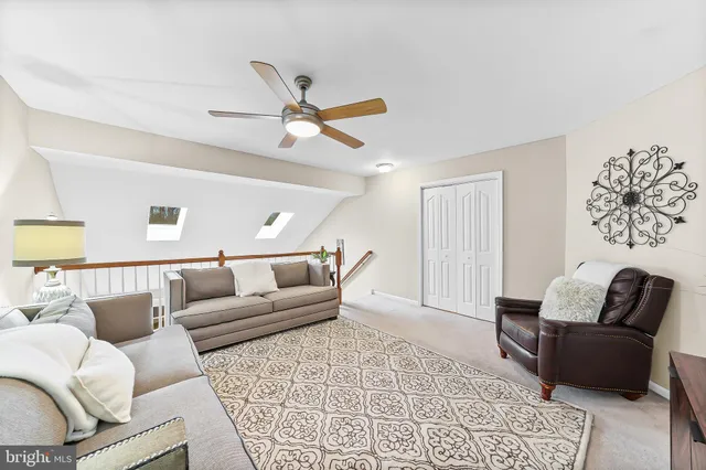 a living room with furniture and a rug