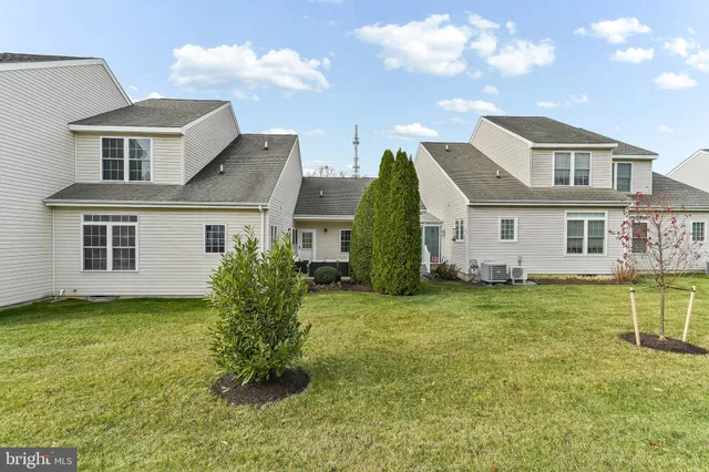 a view of a house with a yard and plants
