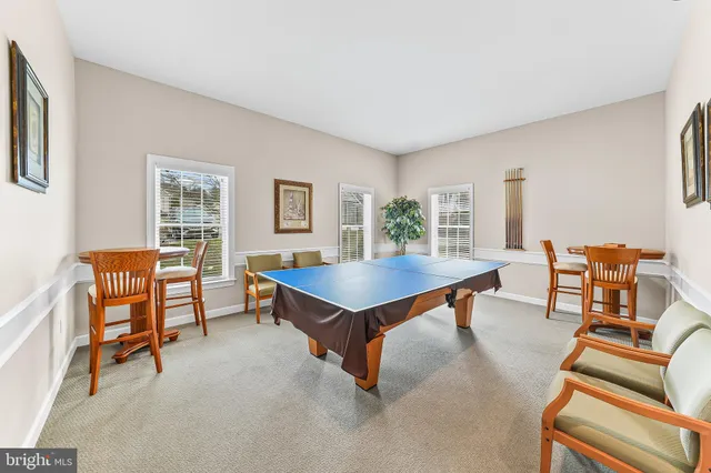 a view of swimming pool with outdoor seating