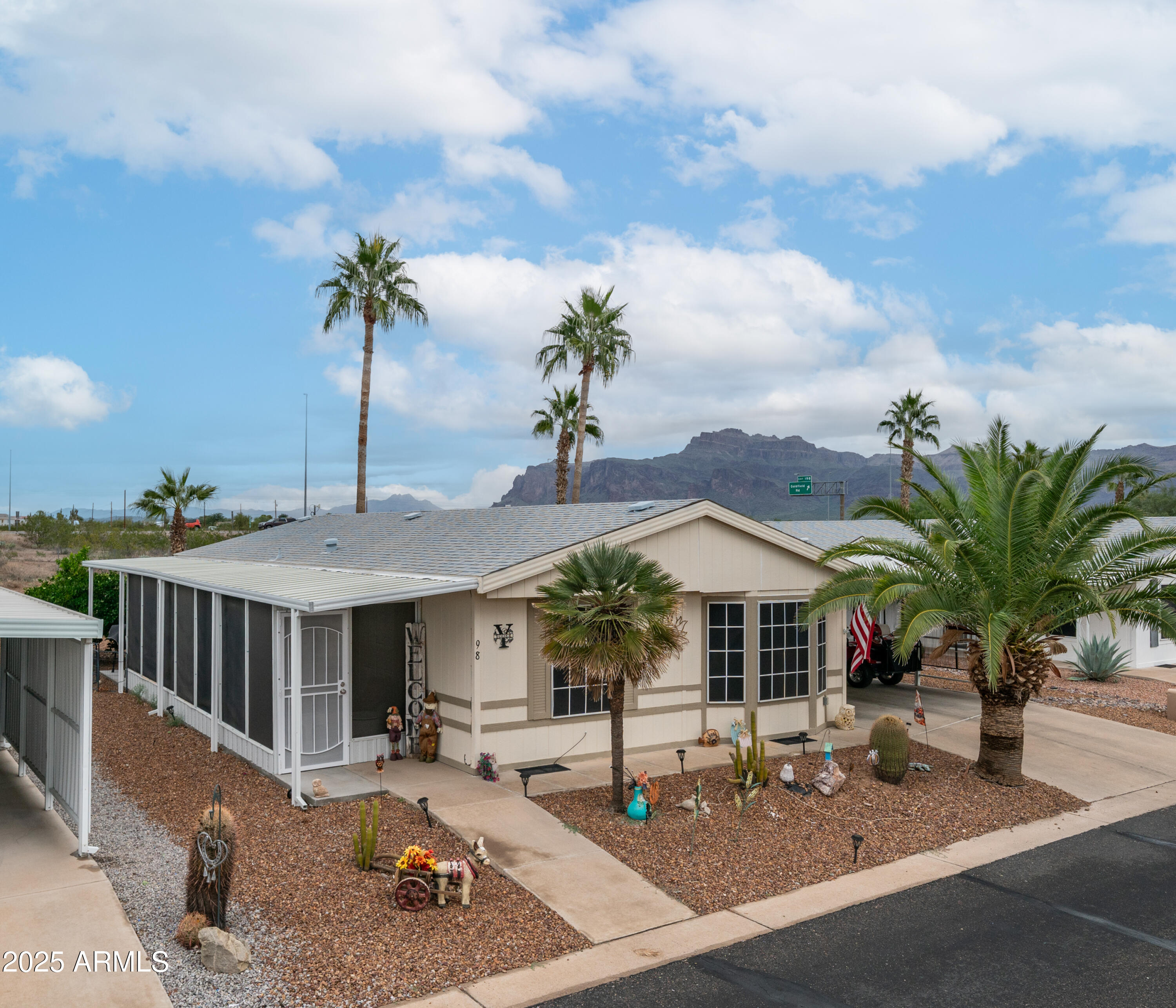 3355 South Cortez Road, Unit 98 Apache Junction, AZ 85119 - Photo 1 of 46 a view of a house with swimming pool and sitting area
