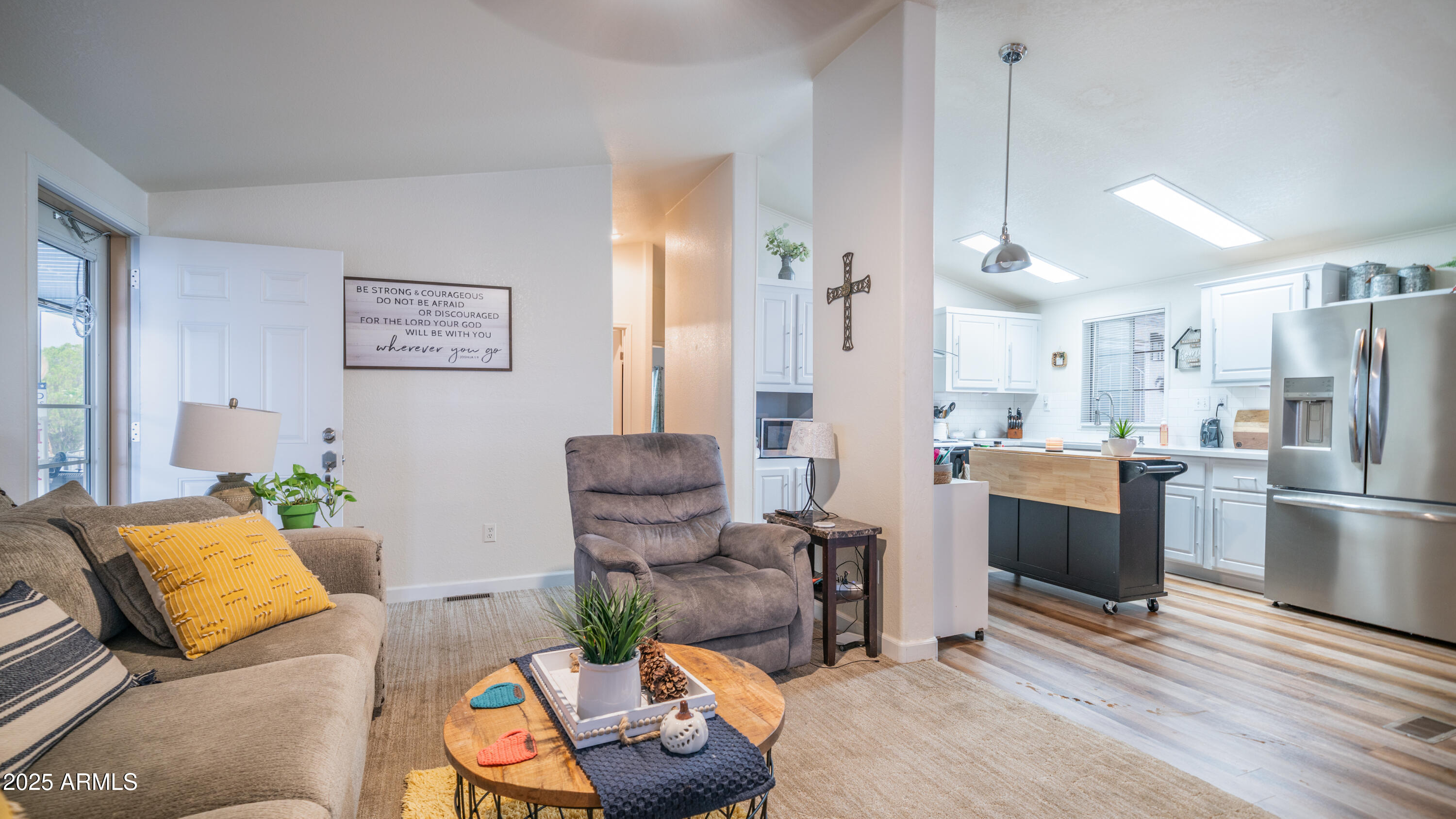 3355 South Cortez Road, Unit 98 Apache Junction, AZ 85119 - Photo 12 of 46 a living room with furniture kitchen view and a wooden floor