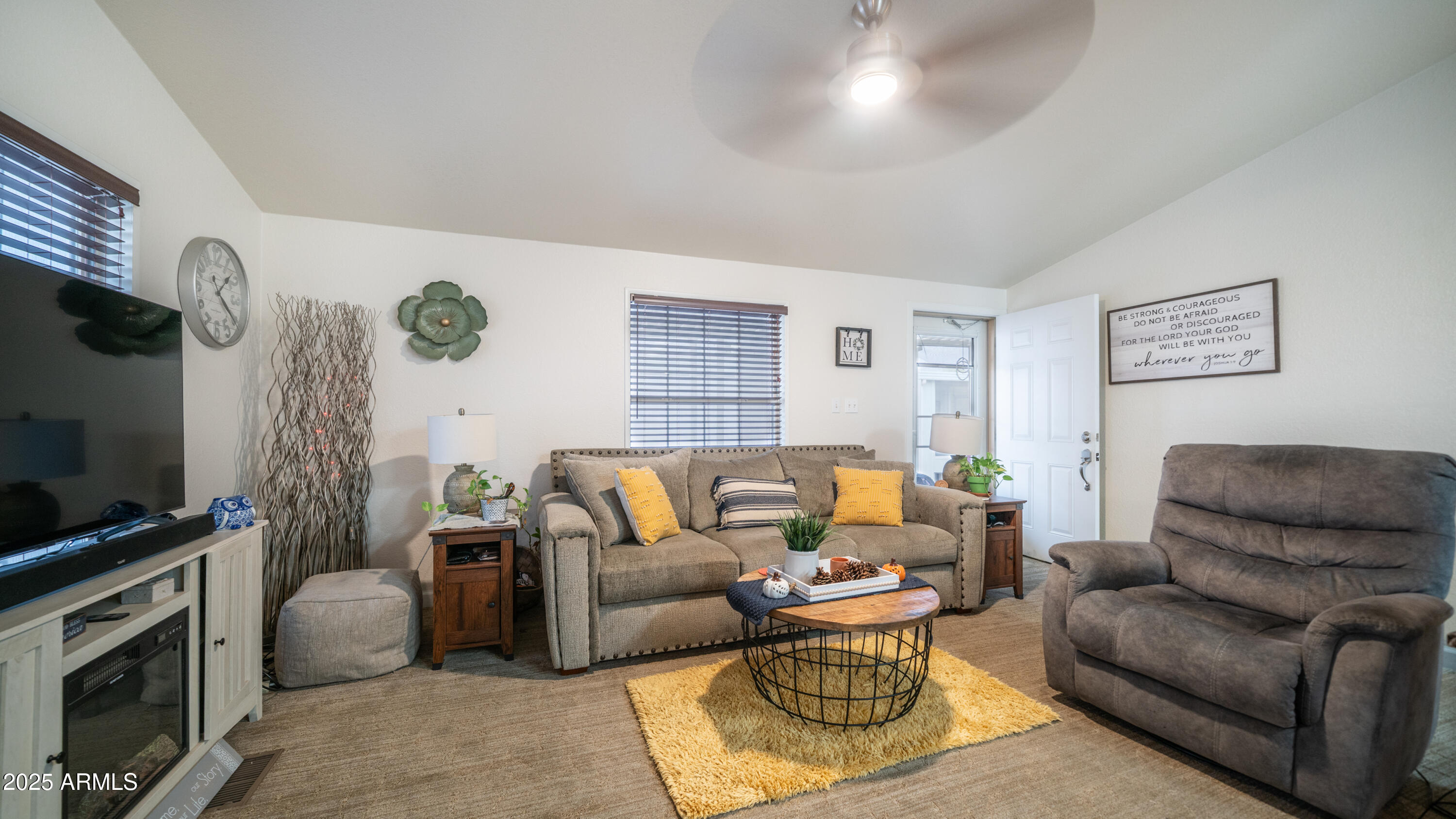 3355 South Cortez Road, Unit 98 Apache Junction, AZ 85119 - Photo 13 of 46 a living room with furniture and a flat screen tv
