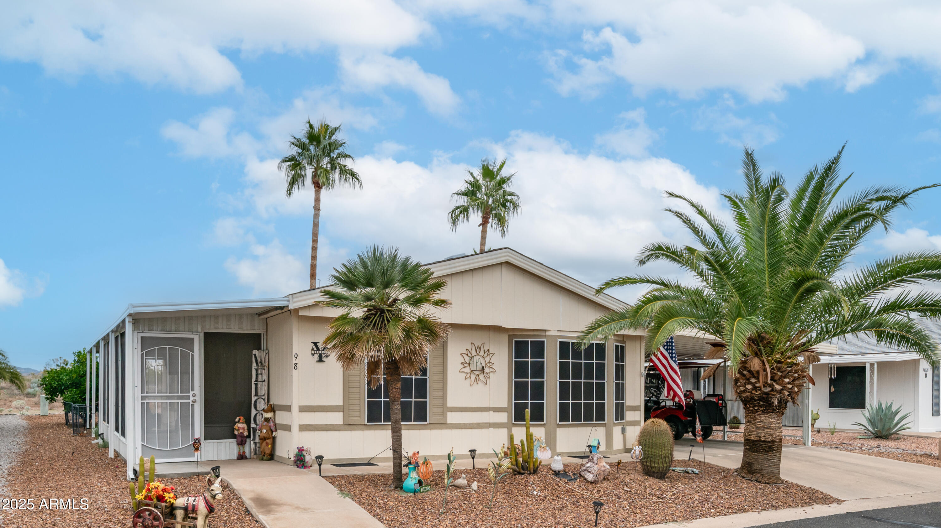 3355 South Cortez Road, Unit 98 Apache Junction, AZ 85119 - Photo 2 of 46 a front view of a house with garden