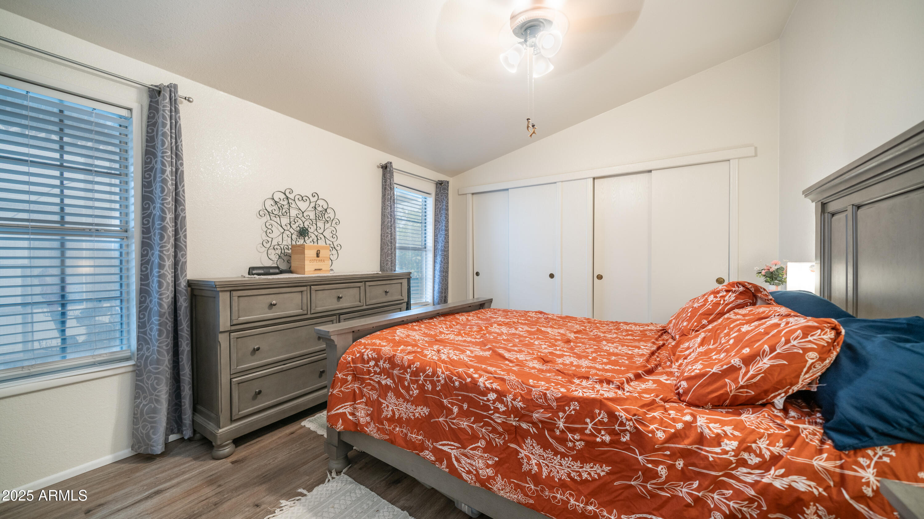 3355 South Cortez Road, Unit 98 Apache Junction, AZ 85119 - Photo 22 of 46 a bedroom with a bed and a cabinets